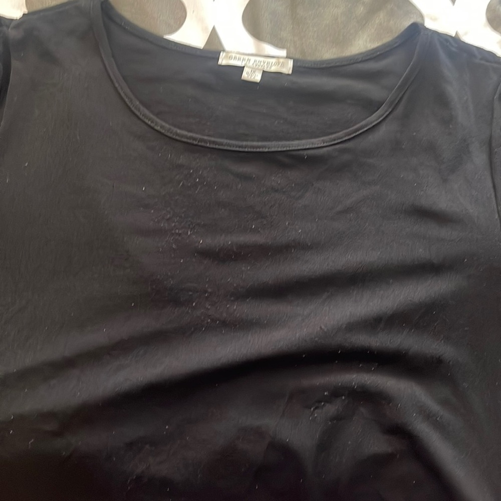 Black dressy top with buttons on the side
